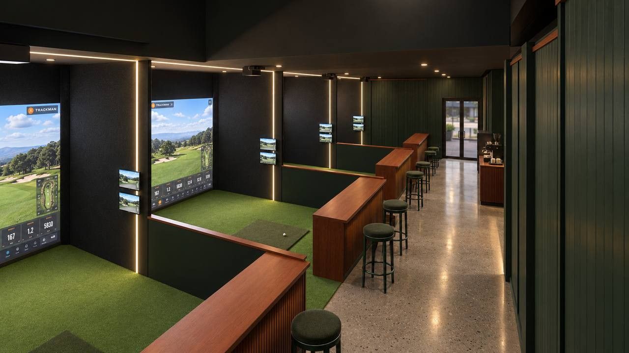 The row of TrackMan simulator bays
